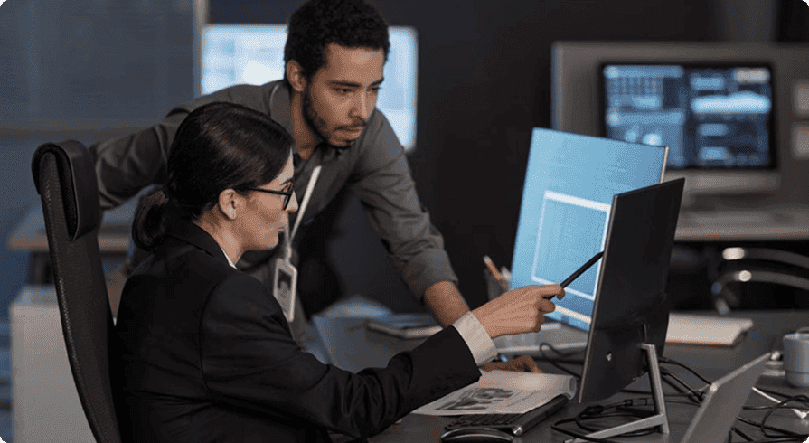 Cybersecurity experts monitoring systems to protect applications and data from cyber threats.